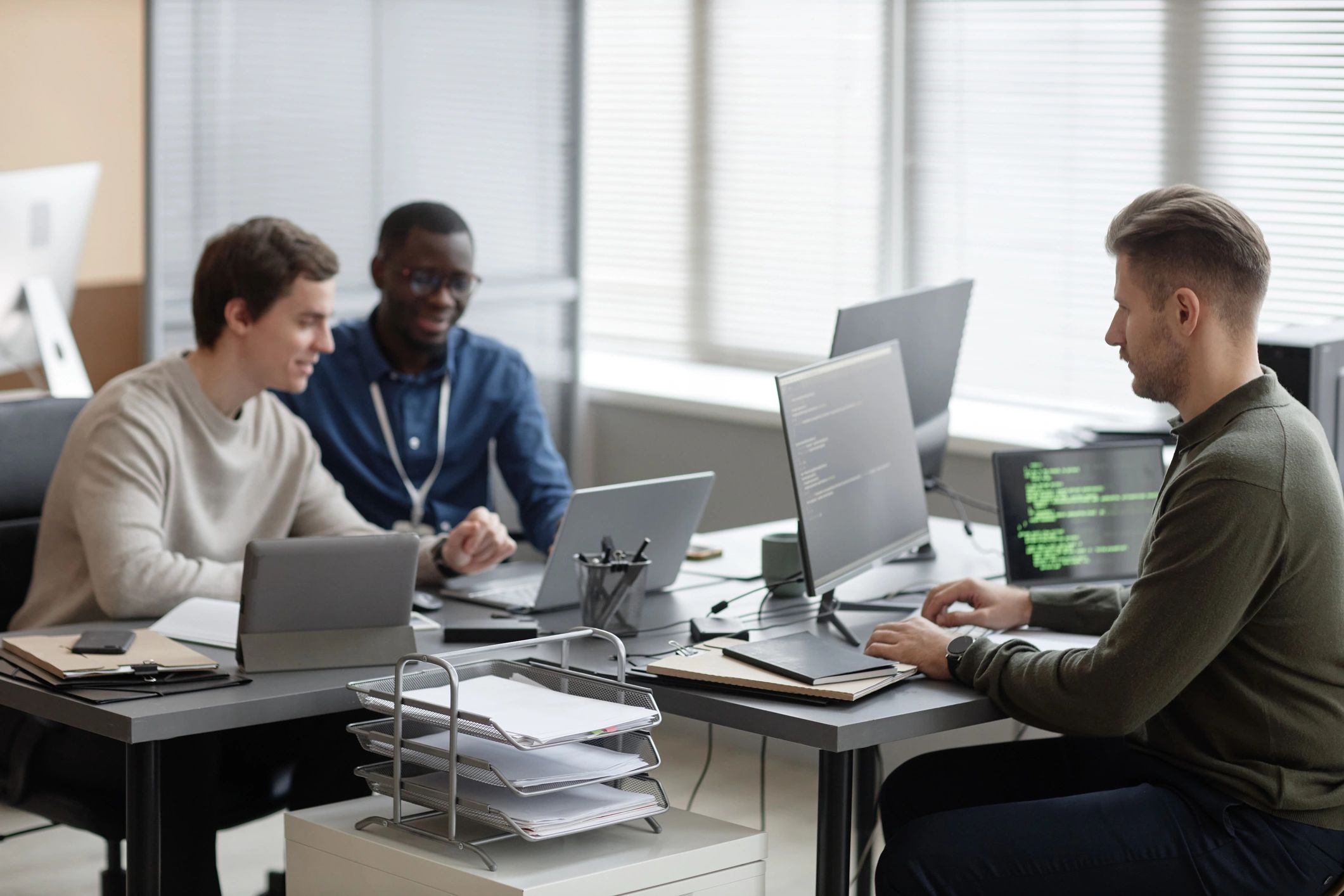 IT professionals working in a modern technology office