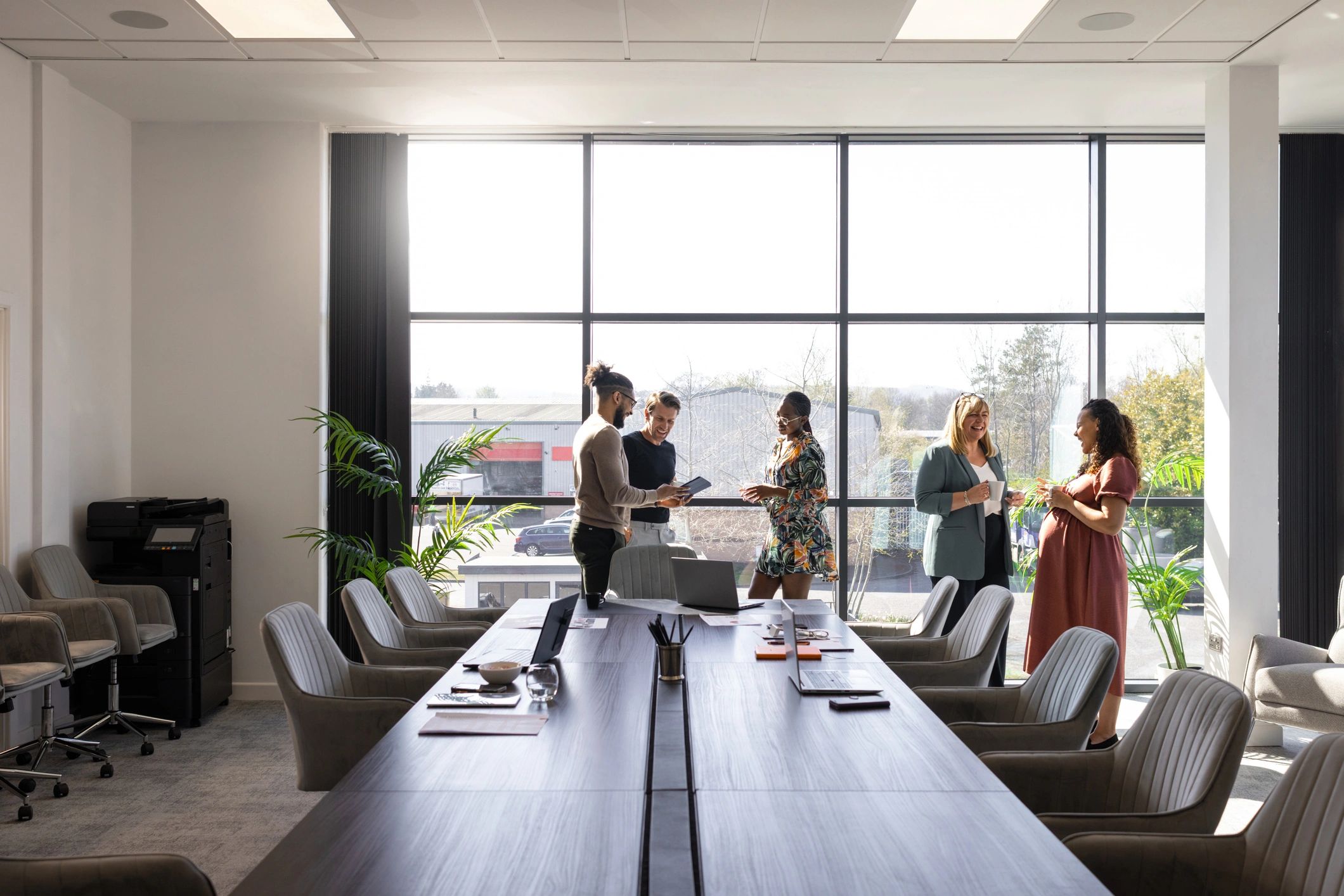 IT services team collaborating in a modern office